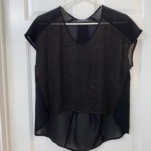 Chelsea & Theodore black top with gold metal design on front, buttons on back